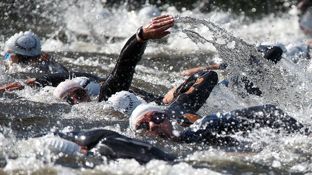 Close up of triathlon swimmers in open water
